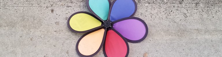 Rainbow pinwheel on concrete